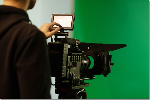 a person touching display while uses camera